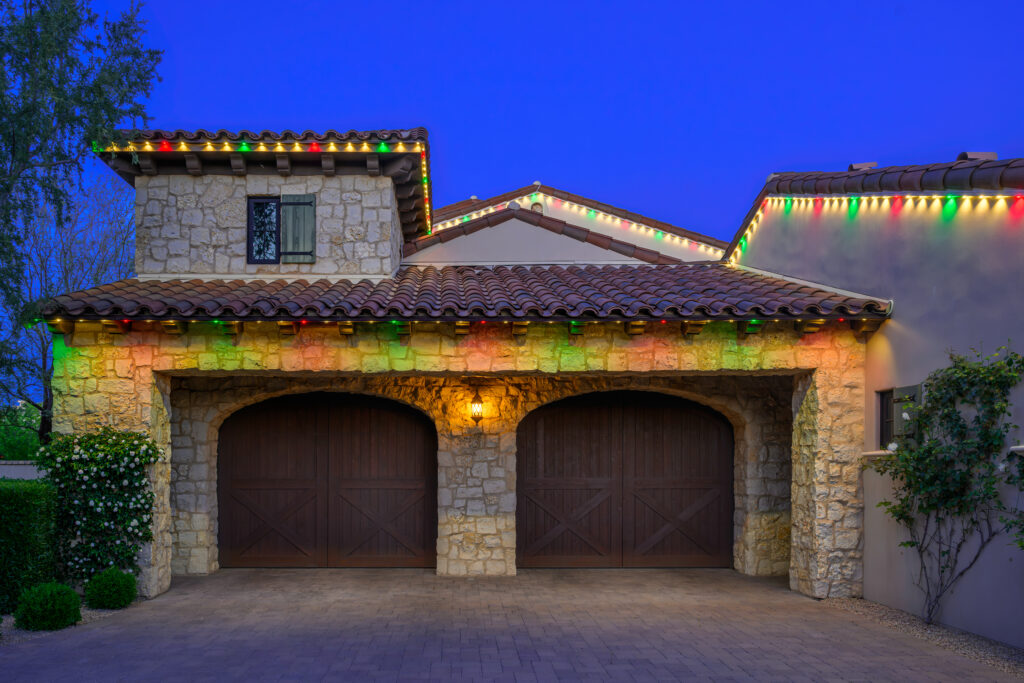 Phoenix home lit with Gemstone permanent trim lighting in red, green, and warm white for the holidays