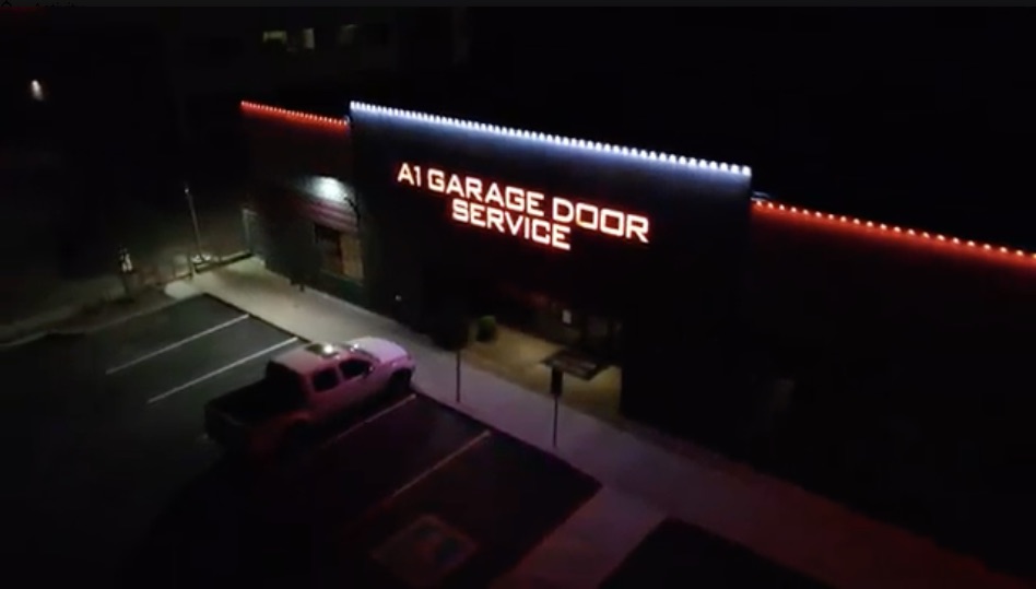 Commercial building with white and red permanent trim lighting in Phoenix at night