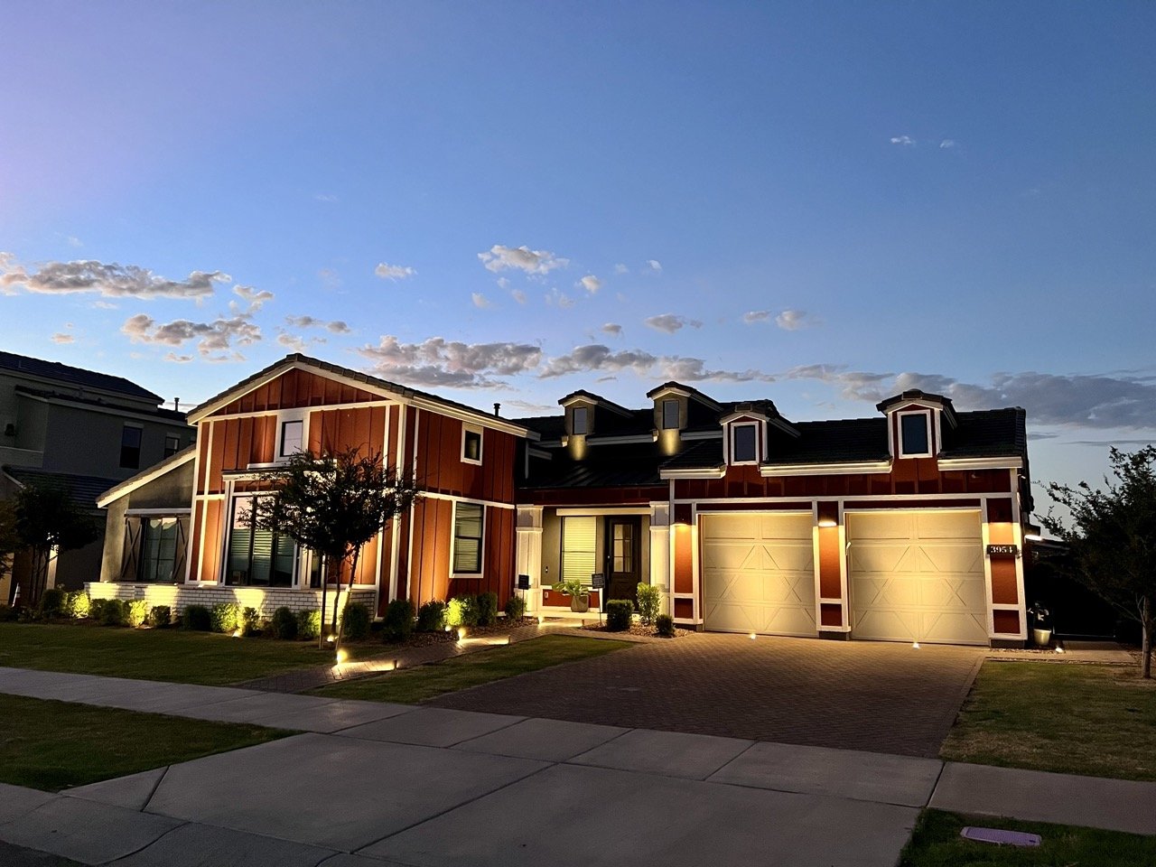 Phoenix home lit at dusk with Stay Off The Roof landscape and architectural lighting