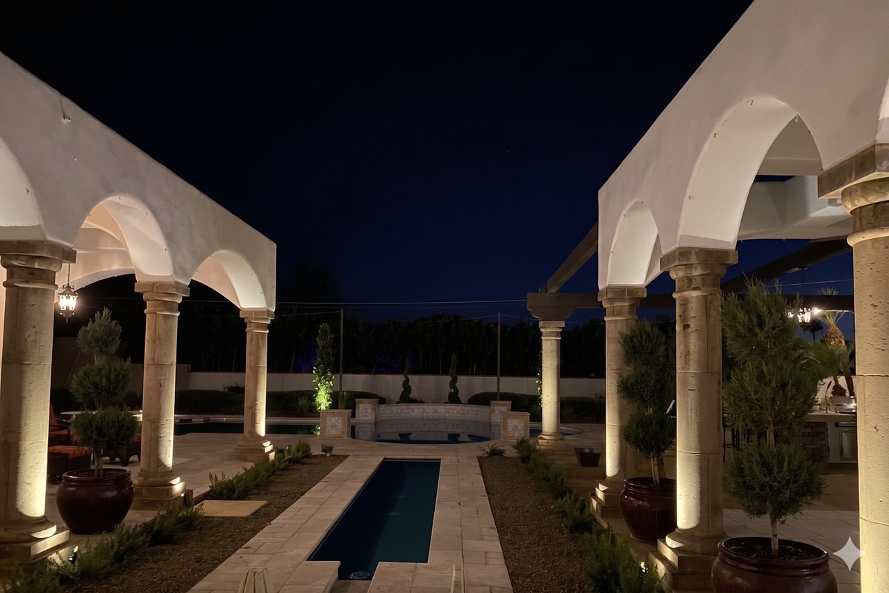 The same Phoenix courtyard patio at night before bistro string lighting was installed