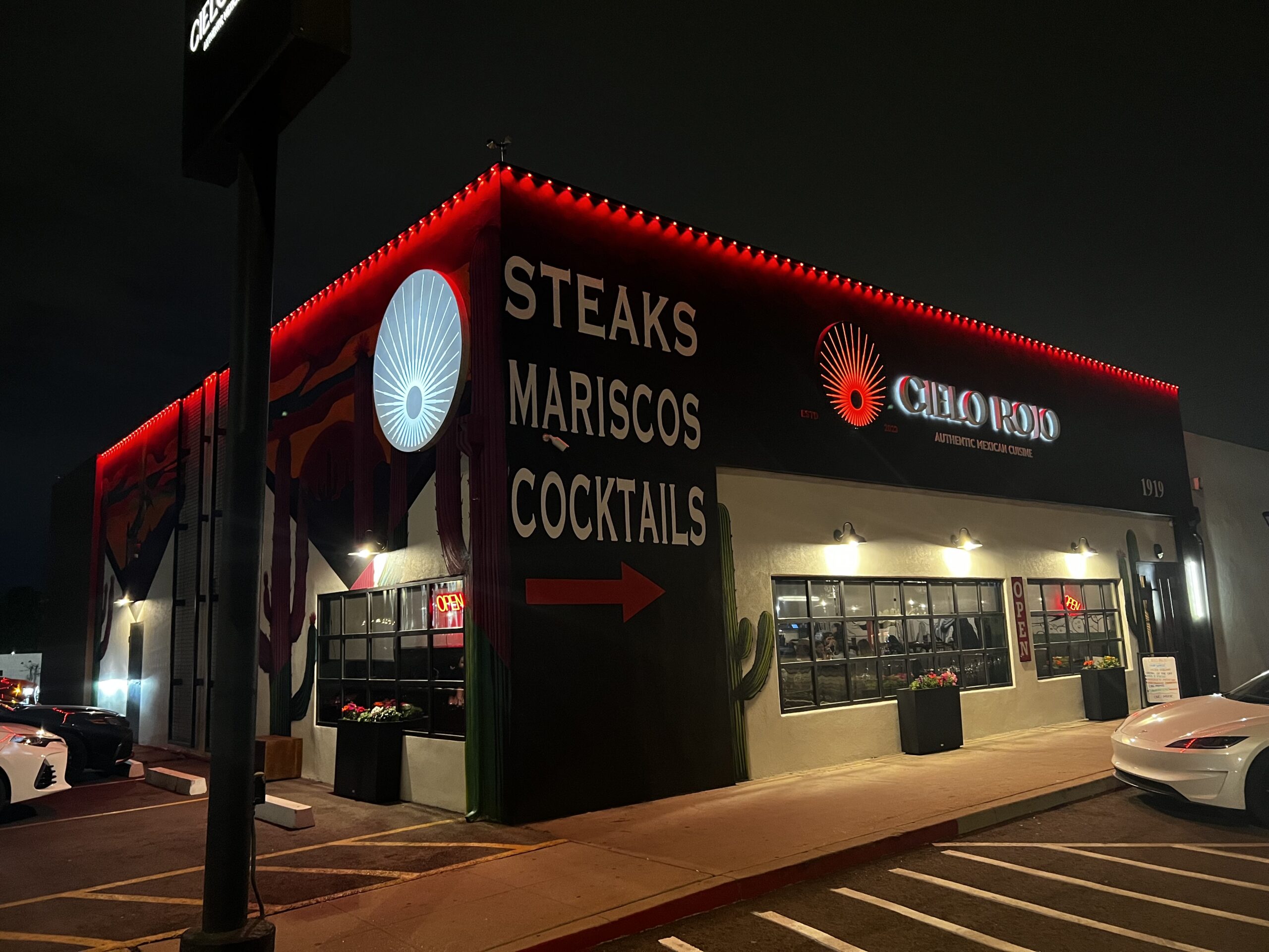 Phoenix restaurant building outlined in red commercial trim lighting at night